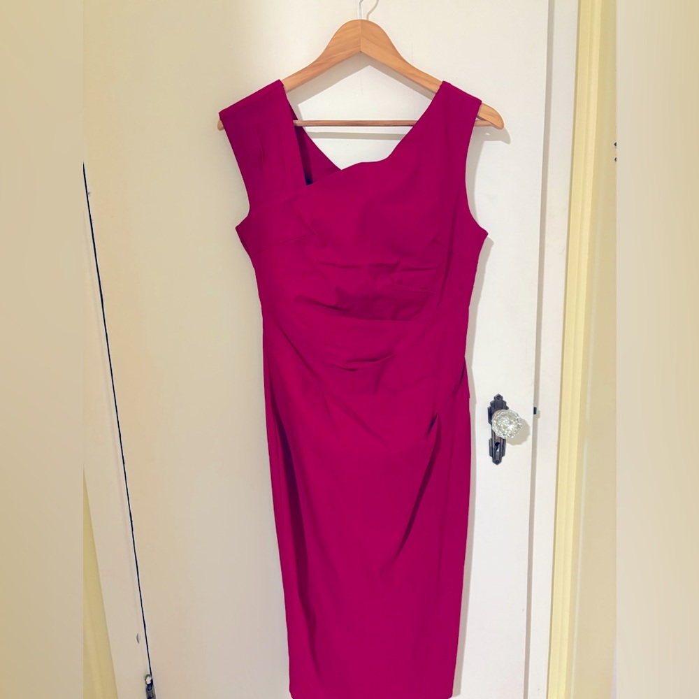 Red sleeveless work to cocktail dress. Side ruching for flattering silhouette